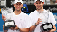 bob and mike bryan with trophies